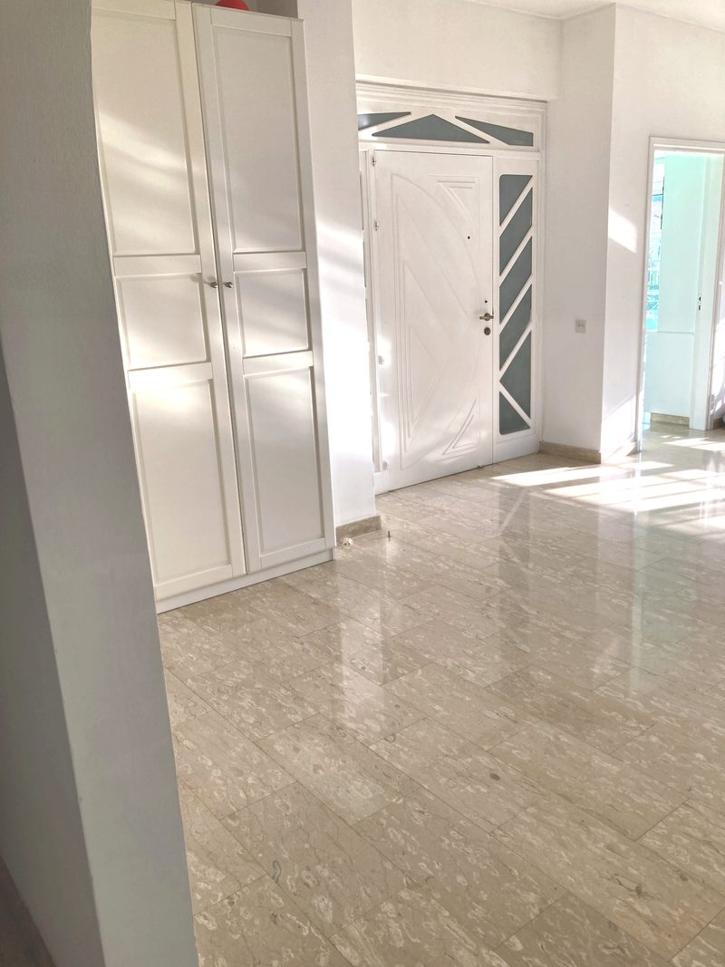 Entrance hall with a bank of built-in storage cupboards