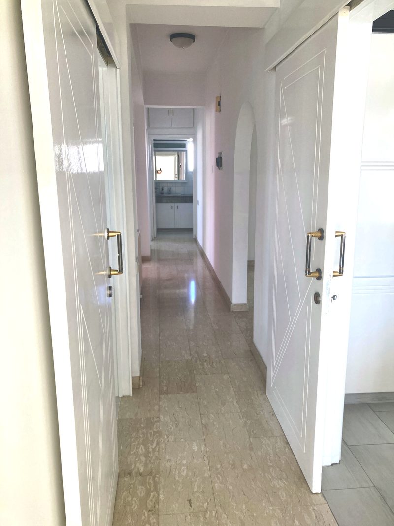 Bright internal hallway connecting the bedrooms and living areas